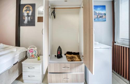 a small bedroom with a bed and a closet at Cendere Old City Hotel in Istanbul