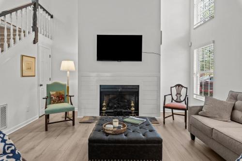 a living room with a couch and a fireplace at Pinehurst Manor 2BR Townhome in Pinehurst