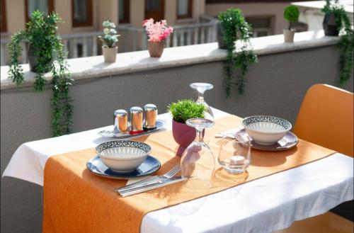 a table with plates and bowls and glasses on it at Cendere Old City Hotel in Istanbul