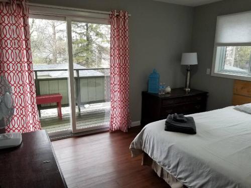 Ένα ή περισσότερα κρεβάτια σε δωμάτιο στο Westlake Cottage - Hillier Lodge
