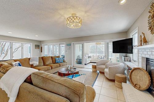 a living room with a couch and a fireplace at Town of Bethany Beach -116 Oakwood St in Bethany Beach