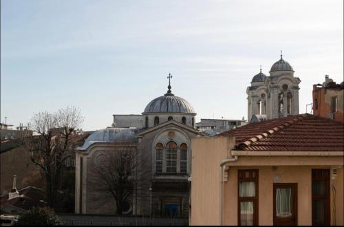 a building with two domes on top of it at Cendere Old City Hotel in Istanbul