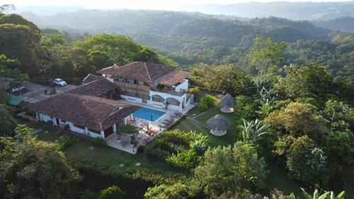 an aerial view of a house in the forest at Hacienda Las Vainillas Boutique Hotel in Mastatal