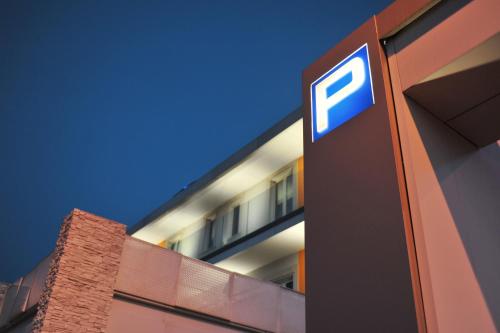 a sign on the side of a building at Hotel Testani Frosinone in Frosinone