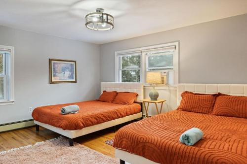 a bedroom with two beds and a window at Big House, Hot tub, Very large backyard in Stony Point