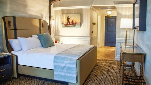 a bedroom with a large bed in a room at Delamar Mystic in Mystic
