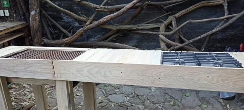 a wooden bed with a grate on top of it at Mindfulness Glamping, Retiro de Yoga, Todo Incluido in Mexico City