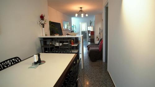 a room with a kitchen and a living room at Apartamento Zepeling by Hr Costabrava in Platja  d'Aro
