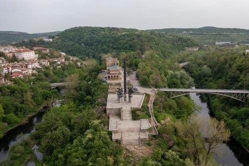 an aerial view of a bridge over a river at Bobevata guest house - Floor 2 - Stunning view Old town in Veliko Tŭrnovo