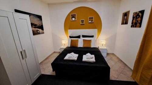 Ένα ή περισσότερα κρεβάτια σε δωμάτιο στο Deluxe Room a Tor Vergata Roma