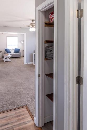 a room with a door open to a living room at Coastal Hubert 3bed Home-Covered Patio, Pet-friendly! in Hubert