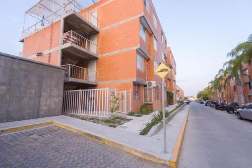 a building on the side of a street at Casa Dorada in Santa Cruz Huatulco