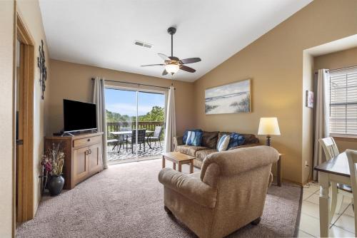 a living room with a couch and a television at The Cove 21-6 By SDC, Big Deck, Pool, Hot Tub, By Lake in Branson