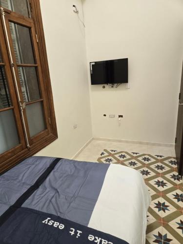 Katil atau katil-katil dalam bilik di Ja guest house