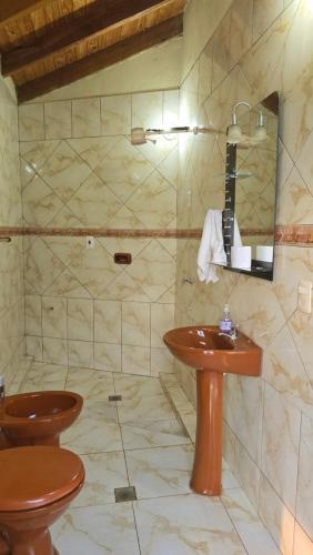 a bathroom with a sink and a toilet at El Jardín Secreto in Trinidad