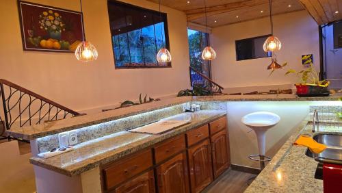 a kitchen with a sink and a counter top at El Jardín Secreto in Trinidad