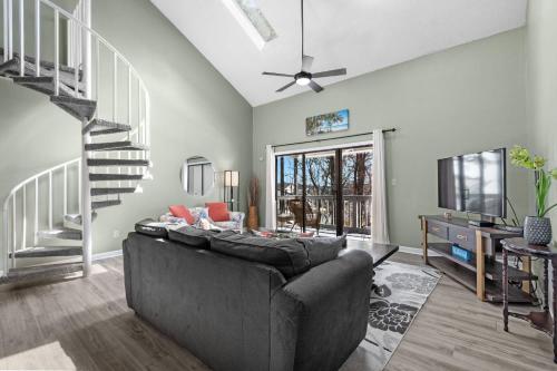 a living room with a couch and a tv at 33H-Golf Colony in Surfside in Myrtle Beach