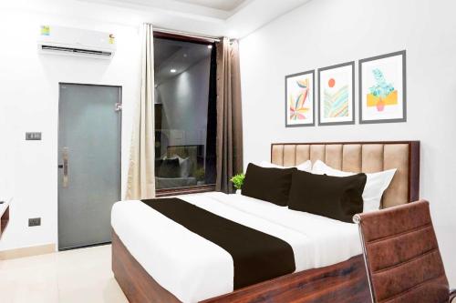 Postel nebo postele na pokoji v ubytování Hotel O Global