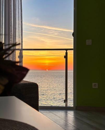 a view of the ocean from a room with a window at Paradise beachfront view 1 in Bar