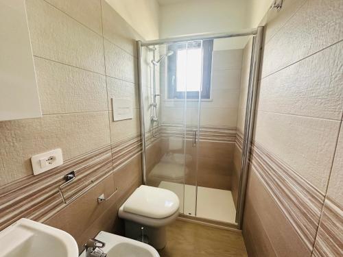 a bathroom with a shower and a toilet and a sink at Porto di Ponza - Immobilevante in Ponza