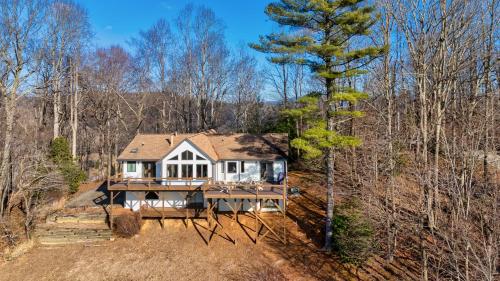 an aerial view of a house in the woods at Sunset Peaks by Carolina Mornings in Asheville