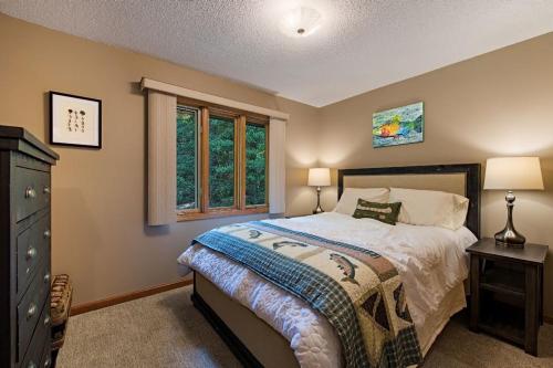 a bedroom with a bed and a window at Sunset Peaks by Carolina Mornings in Asheville