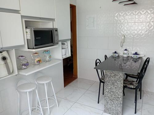 Kuchyň nebo kuchyňský kout v ubytování Apartamento em Coqueiral de Itaparica