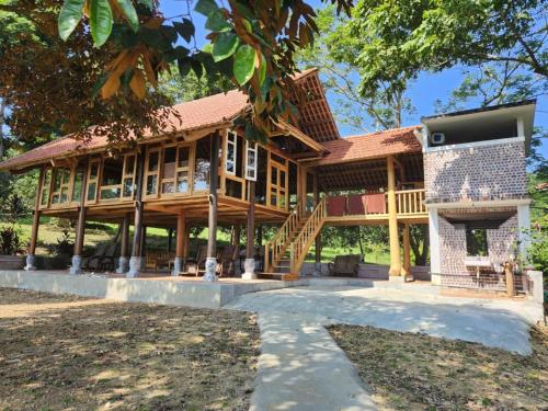 a house being constructed with a roof at Green Vietnam Farm Stay in Làng Trang
