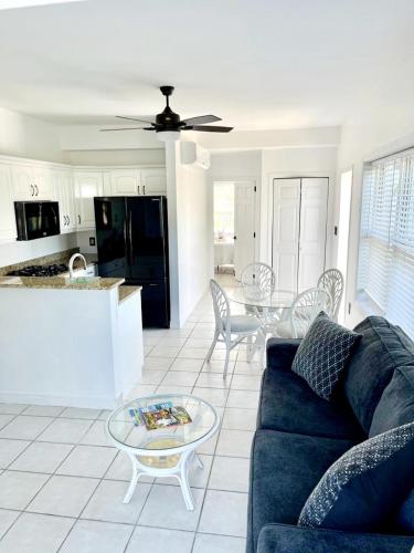 a living room with a couch and a table at The Seagate in The Bight Settlements