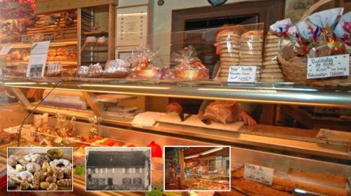 a display case of a bakery with bread and pastries at Loft "Home, Sauna & Pool" in Osenbach