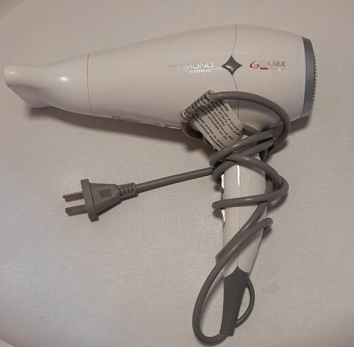 a hair dryer is attached to a wall at Decorama Vista in Dolores