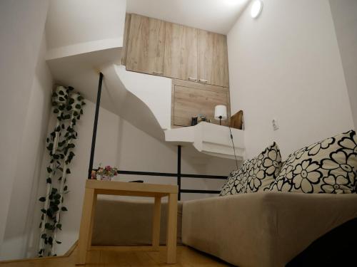 a living room with a couch and a table at Terazije apartment in Belgrade