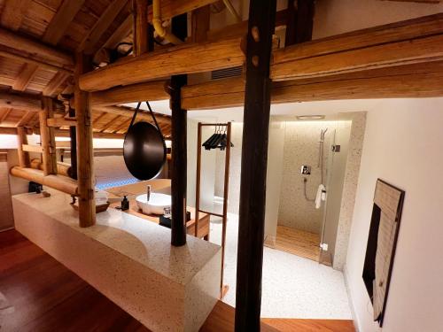 a view of a room with a bathroom in a house at Jingdezhen Taoyi Shangnong Hotel in Jingdezhen