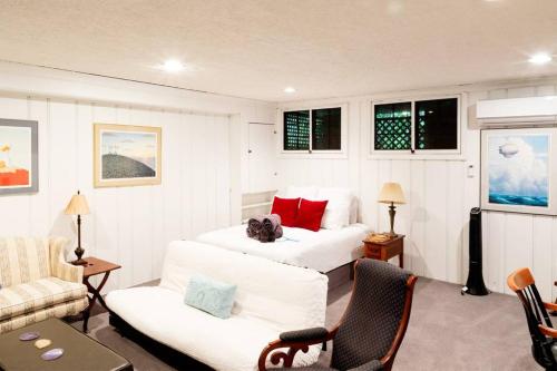 a hotel room with two beds and a couch at Huge Studio w Full Kitchen W D Parking in Washington, D.C.