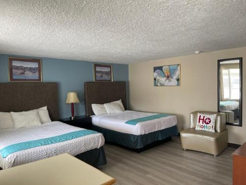 Ένα ή περισσότερα κρεβάτια σε δωμάτιο στο Safari Motel