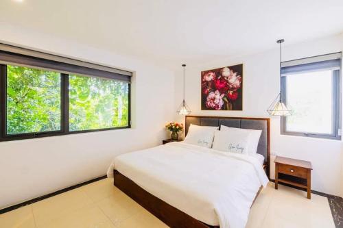 Postel nebo postele na pokoji v ubytování Ivory Villa Resort