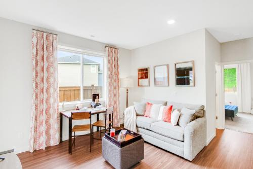 a living room with a couch and a table at Cozy Oasis in Port Orchard - Private 1BR Suite with Trails in Port Orchard
