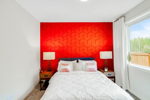 a bedroom with a red headboard and a bed at Cozy Oasis in Port Orchard - Private 1BR Suite with Trails in Port Orchard