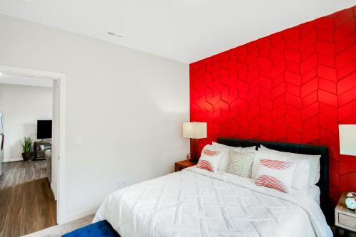 a bedroom with a red headboard and a white bed at Cozy Oasis in Port Orchard - Private 1BR Suite with Trails in Port Orchard