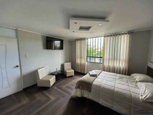 Postel nebo postele na pokoji v ubytování Hotel Douce Nuit