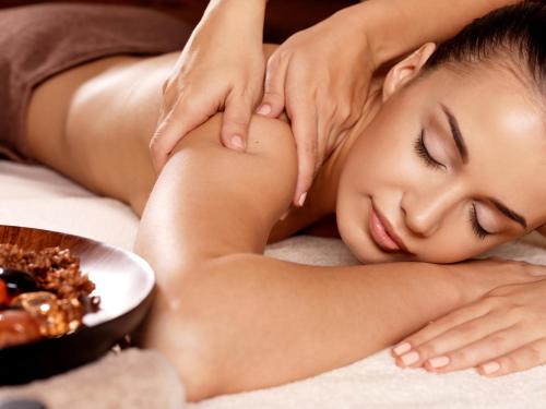 a woman getting a massage at a spa at Jomtien Sands Residence in Jomtien Beach