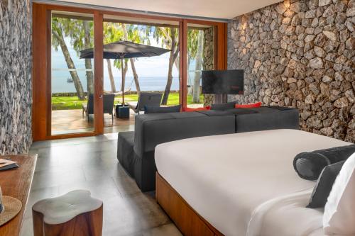 Postel nebo postele na pokoji v ubytování Tolani Resort Kui Buri