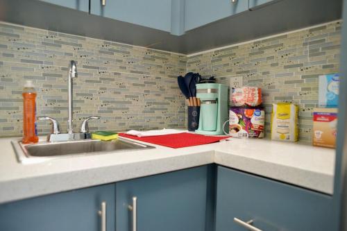 a kitchen with a sink and a counter top at Spacious Studio heart Of Miami in Miami