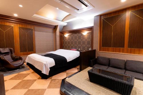 Katil atau katil-katil dalam bilik di 今池ホテルアウラガーデン 大人専用
