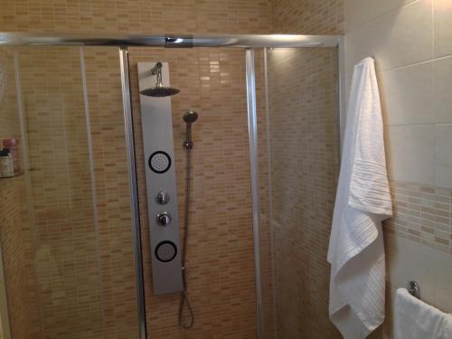 a shower with a glass door in a bathroom at Casa Petra - Mini Open Space in Brindisi