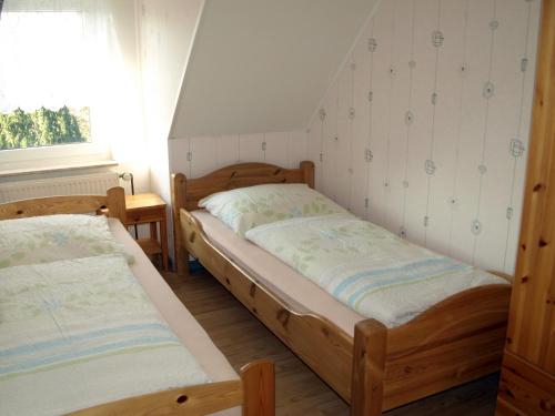 Ліжко або ліжка в номері Haus Edzards