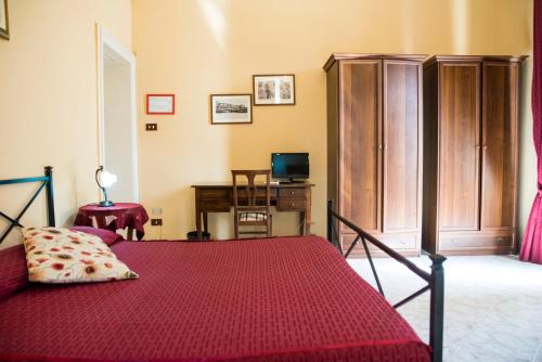 Una cama o camas en una habitación de Sognando Ortigia
