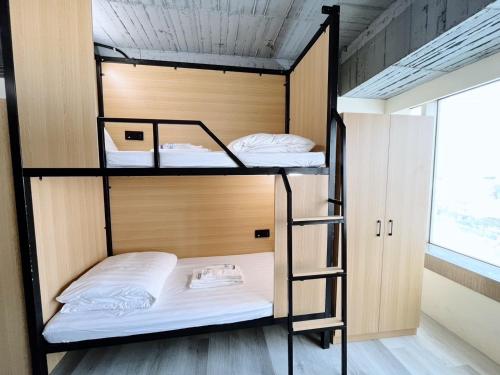 Postel nebo postele na pokoji v ubytování Yoai Mountain Roam Hotel