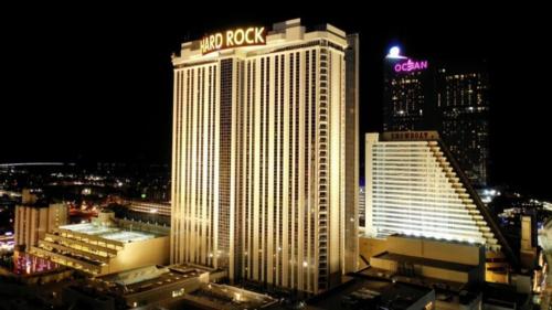 a large building with a moxy rock sign on it at Beachfront 1BR 2BA Condo CozySuites at Showboat in Atlantic City