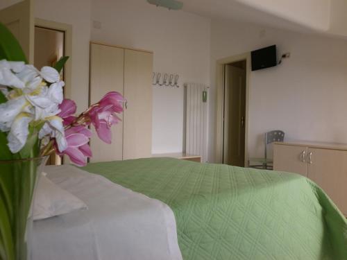 Ένα ή περισσότερα κρεβάτια σε δωμάτιο στο La Roccia